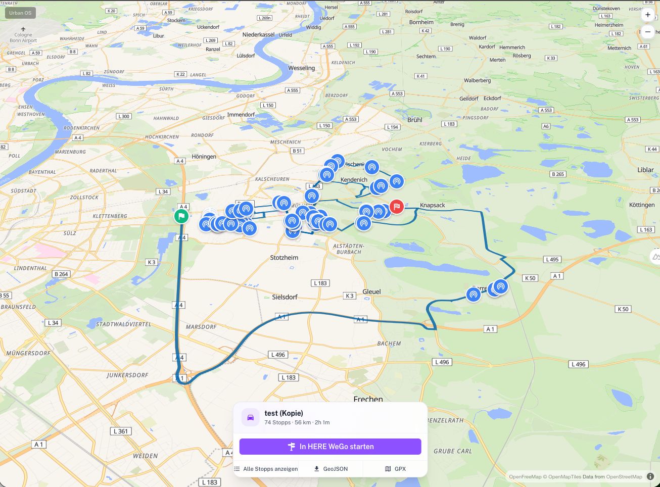 Capture d'écran : carte avec une tournée planifiée de 74 arrêts, transfert vers HERE WeGo et export GeoJSON et GPX